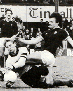 Billy Thomson bravely beats<br>Brian Scrimgeour to the ball