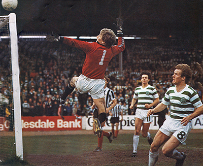 Billy Thomson clears the danger from Murdo McLeod